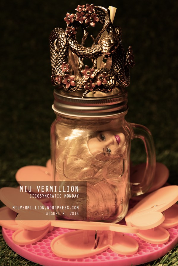 Miu Vermillion | Fashion Still Life - Barbie head in mason jar + Roberto Cavalli cuff bracelet
